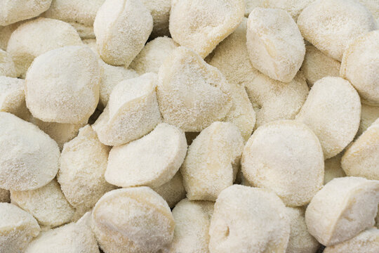 Uncooked filled capelettis