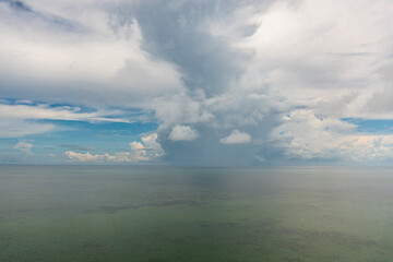 Beautiful stunning vibrant landscape, blue sea and sky with white clouds, aerial view of the sea