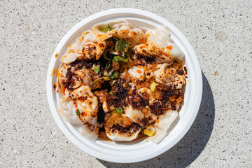 Chinese Szechuan Style Spicy Wontons with Chili Oil in a Bowl