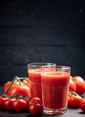 Juice from ripe tomatoes on the table. 