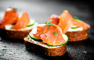 Salmon sandwich on the table. 