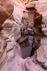 Fantastically beautiful landscape in the national nature reserve - Red Canyon in the rays of the setting sun, near the city of Eilat, in southern Israel