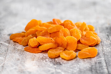 A pile of delicious dried apricots on the table. 