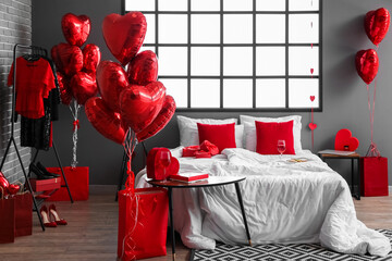Interior of bedroom decorated for Valentine's Day with balloons and hearts