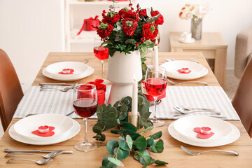 Table setting for Valentine's Day with beautiful flowers in dining room