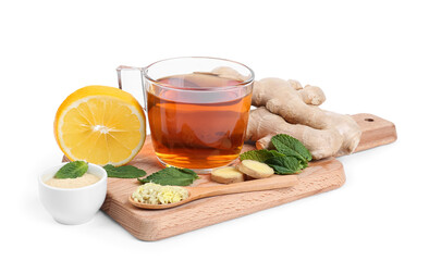 Board with ginger roots, glass cup of black tea, mint and lemon isolated on white background