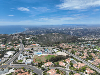 Aerial view over La Jolla Hills with big villas and ocean in the background, San Diego, California, USA