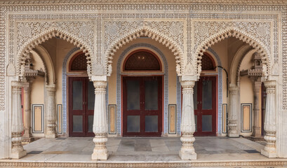 Exterior view of intricate designed arches of Mubarak mahal in Jaipur, Rajasthan, India - obrazy, fototapety, plakaty
