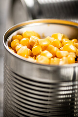 An open can of canned corn. 