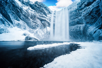 Majestic nature of winter Iceland. Impressively View on Skogafoss Waterfal. Skogafoss the most famous place of Iceland - obrazy, fototapety, plakaty