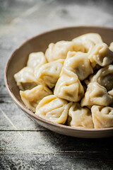Boiled homemade dumplings on a plate. 