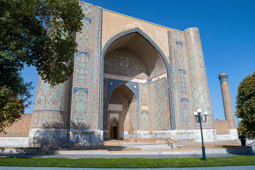 The main portal of the medieval Bibi Khanum Madrasah (1404) close-up on a sunny September day. Samarkand