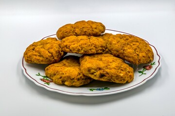 Pumpkin cookies are on a plate