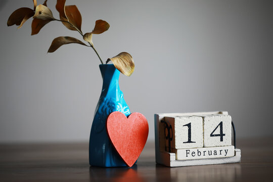 Wooden calendar show of February 14 with red heart