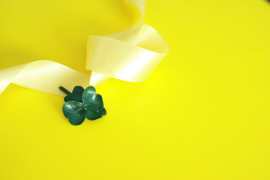 St. patrick's day background. Religious Christian Irish celebration. Bow with four-leaf clover symbol of good luck.