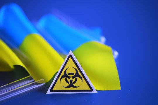 Ukrainian flag biohazard and test tubes. Assistance to Ukraine in biolaboratories. Western biological laboratories in Ukraine.