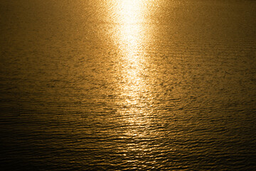Water surface of the lake and the sea during sunset and incident light