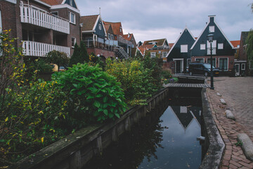 Fototapeta na wymiar Cozy Houses With Balconies In Volendam, Houses Near The Canal In Volendam