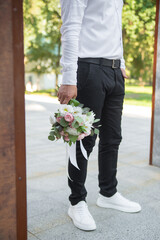 delicate wedding bouquet in the hands of the groom. idea for event agencies