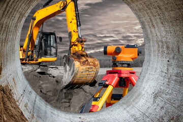 Modern level for geodesy at a construction site. Surveyors ensure precise measurements before...