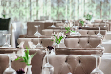 restaurant with grey chairs and flowers