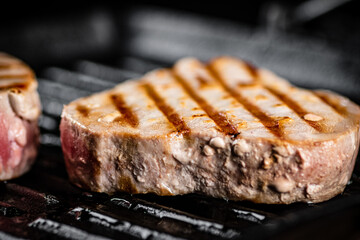 Tuna steak in a grill pan. 