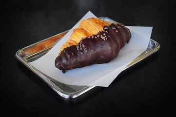 Chocolate Croissant on stainless Steel tray