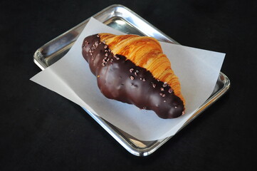 Chocolate Croissant on stainless Steel tray