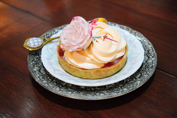 Lychee and Rose Tart on white ceramic plate