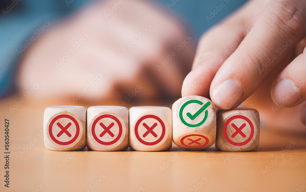 Poster hand flipping green correct sign symbol among red incorrect or cross sign for document check approve