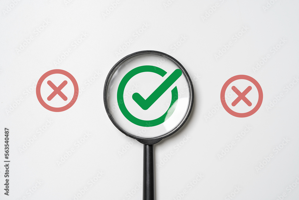 Poster green correct sign symbol inside of magnifier glass and among red incorrect or cross sign for focus 