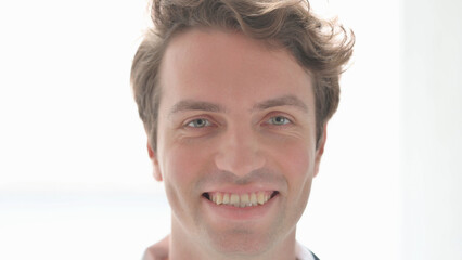 Fototapeta premium Face Close Up of Smiling Young Man