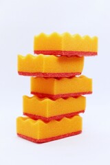 Set of orange sponges for washing dishes