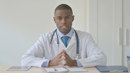 Blogging African Doctor Talking in Camera in Clinic