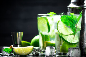Traditional mojito with pieces of lime and mint. 