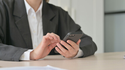 Fototapeta premium Close Up of Young Businesswoman Using Smartphone