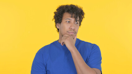 Brainstorming African Man Thinking on Yellow Background