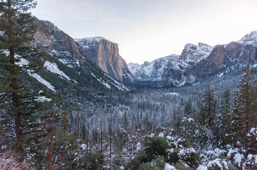 Panoramic view over Yosemite valley, from Tunnel view, showing a snow-covered valley at Dawn