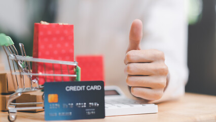 Male hands showing excellence,Shopping concept, online web shopping and home delivery service, connects merchants and customers worldwide, online payment, consumer society,cashless society