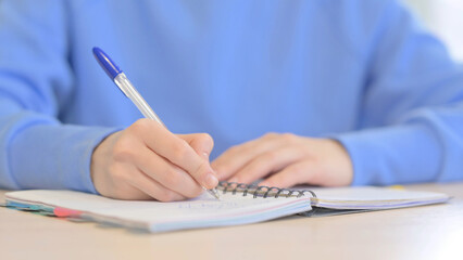 Close up of Woman Writing Letter in Office