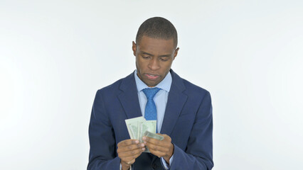 African Businessman Counting Dollars on White Background