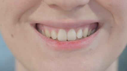 Fototapeta premium Close Up of Smiling Lips of Woman