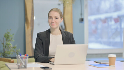 Businesswoman Shaking Head in Rejection while Working on Laptop