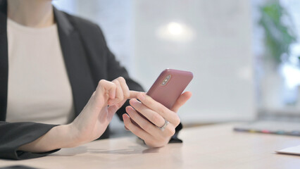 Close up of Businesswoman Browsing Internet on Smartphone