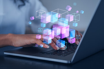 Businesswoman wearing formal wear is typing on laptop with metaverse