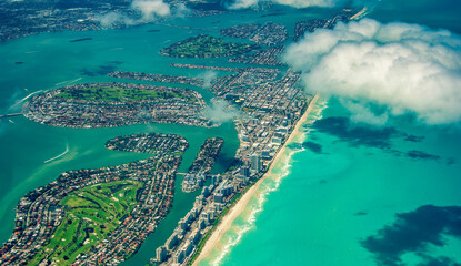 Amazing aerial view of Miami Beach skyline and coastline from a departing airplane