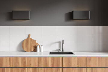 Fototapeta na wymiar Stylish kitchen interior with cooking area, sink and kitchenware