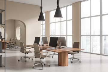 Corner view on bright office room interior with computers, desks