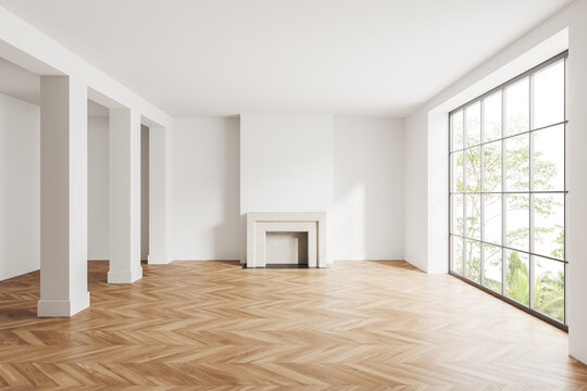 Light empty room interior with fireplace, panoramic window and column