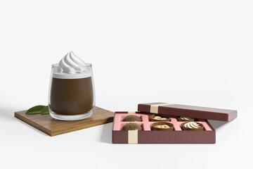 Hot cocoa and brown box with chocolate sweets on white empty background